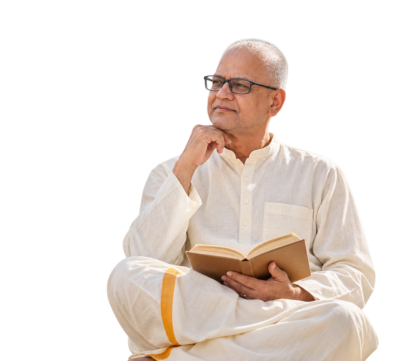 Rajesh Anand seated with an open book, reflecting thoughtfully