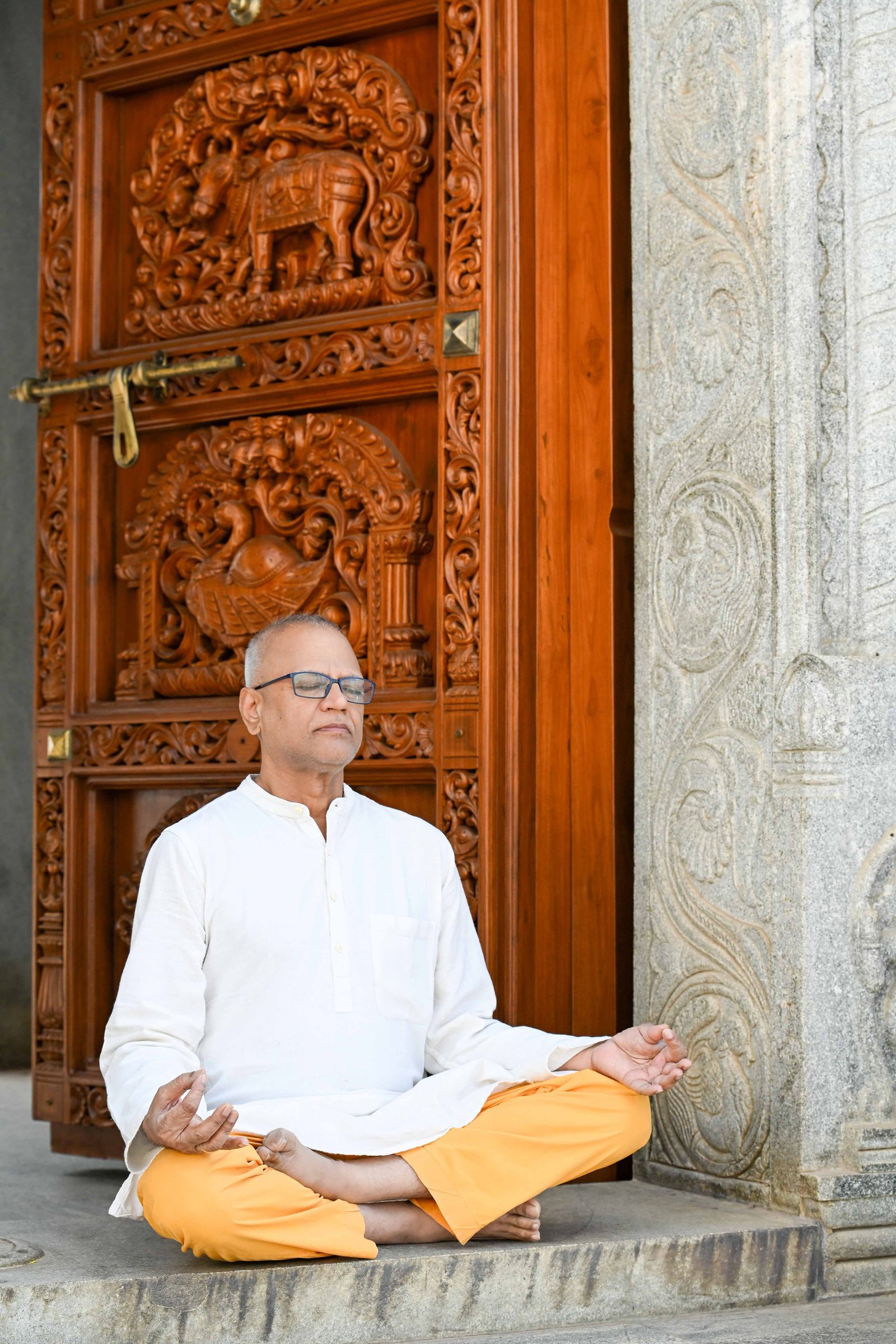 Rajesh Anand sitting in a temple doorway